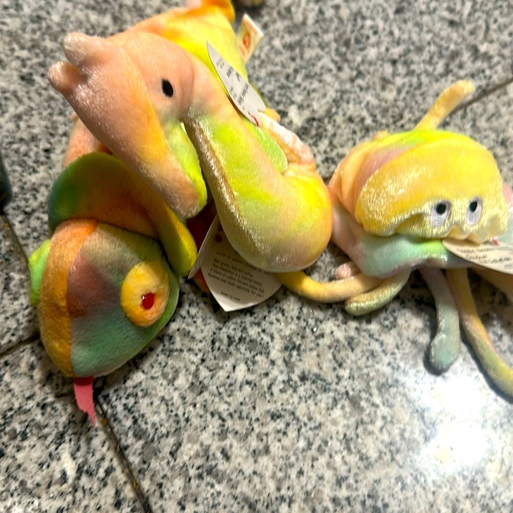 Various beanie babies, rainbow neon, Gucci, the jellyfish